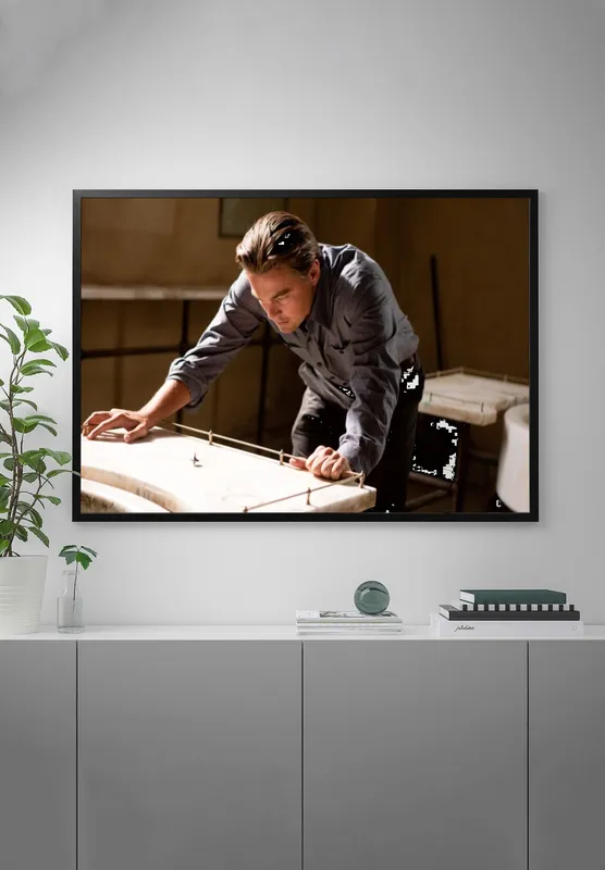 Постер «Постер Начало — Леонардо Ди Каприо в фильме Кристофера Нолана» на стене в офисе