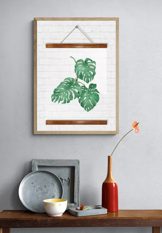 Постер «Прозрачный постер - Три больших резных листа» над диваном в гостиной