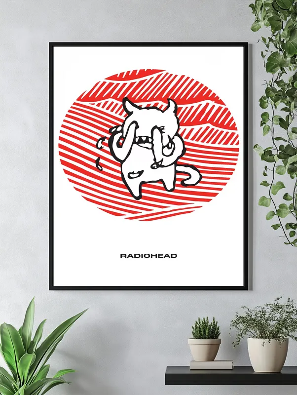 Постер «Radiohead - Amnesiac» над диваном в гостиной