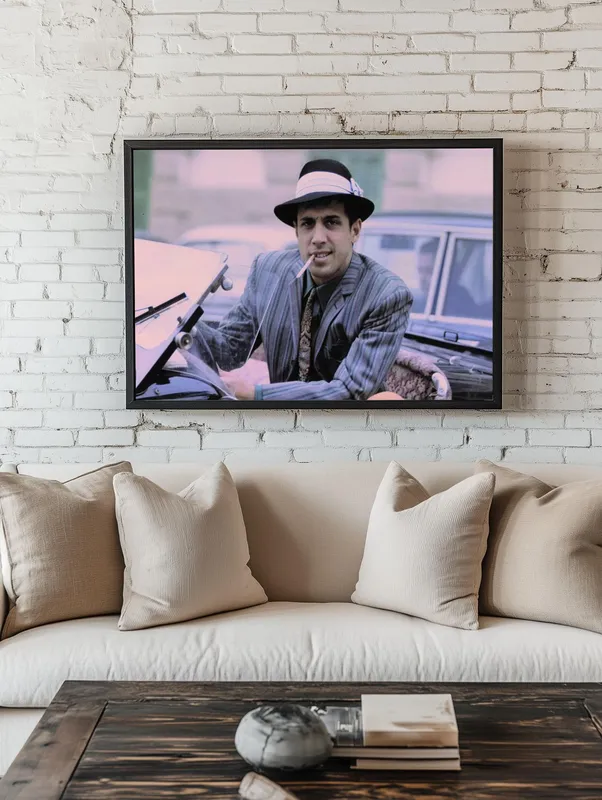 Постер «Адриано Челентано в авто» над диваном в гостиной